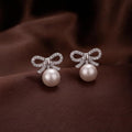 JewelMaze Silver Plated Bow Shape Austrian Stone & Pearl Stud Earrings for Women 